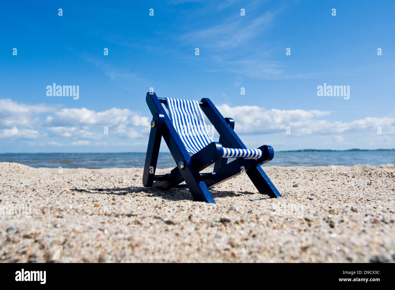 Deck chair on the beach Stock Photo