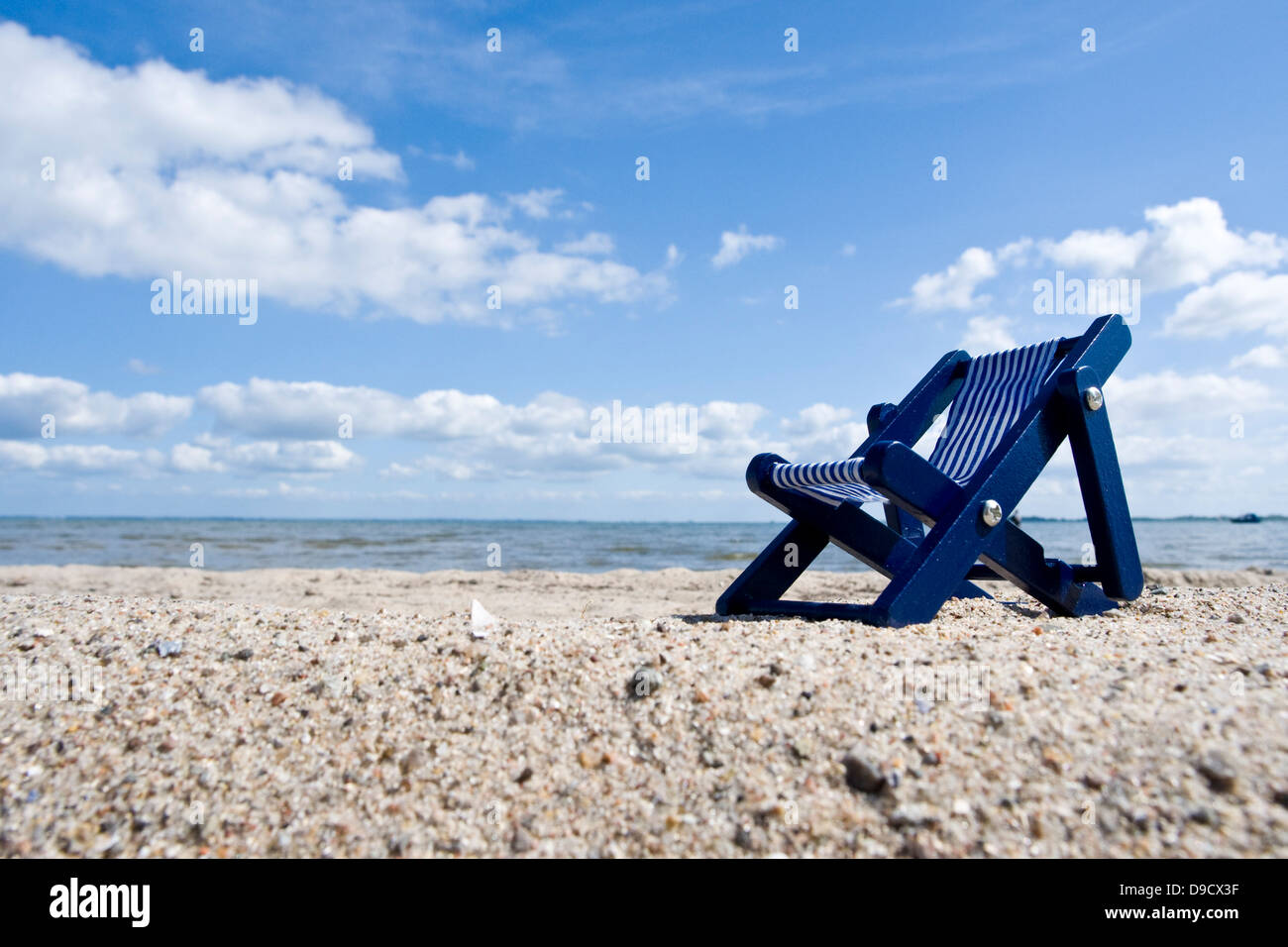 Deck chair on the beach Stock Photo