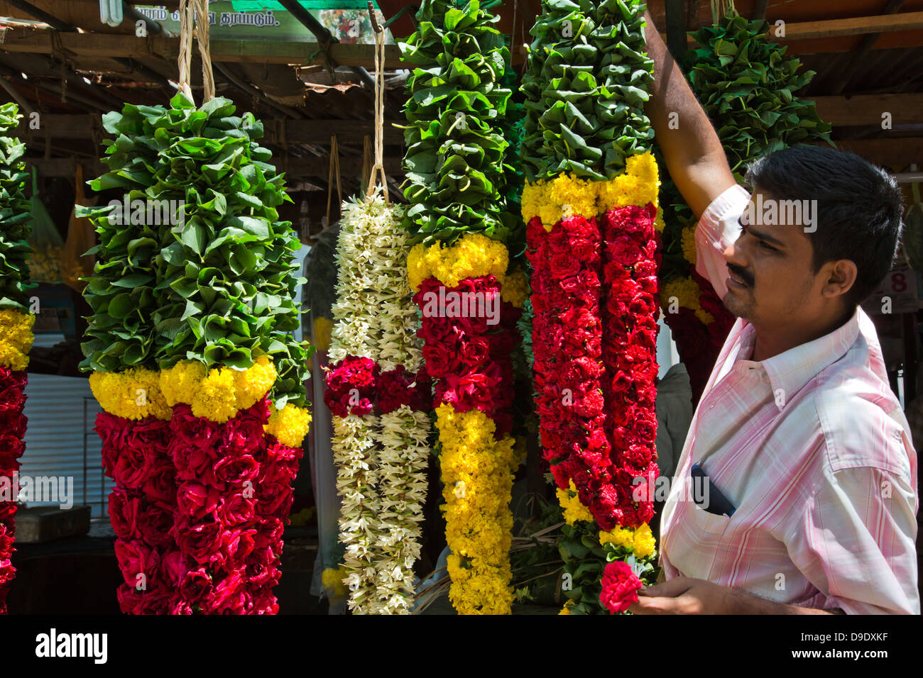 Garlands for sale hanging at a market stall, Chennai, Tamil Nadu, India Stock Photo