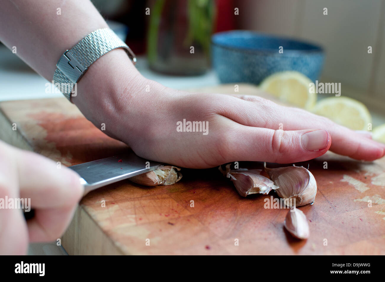 squashing garlic Stock Photo