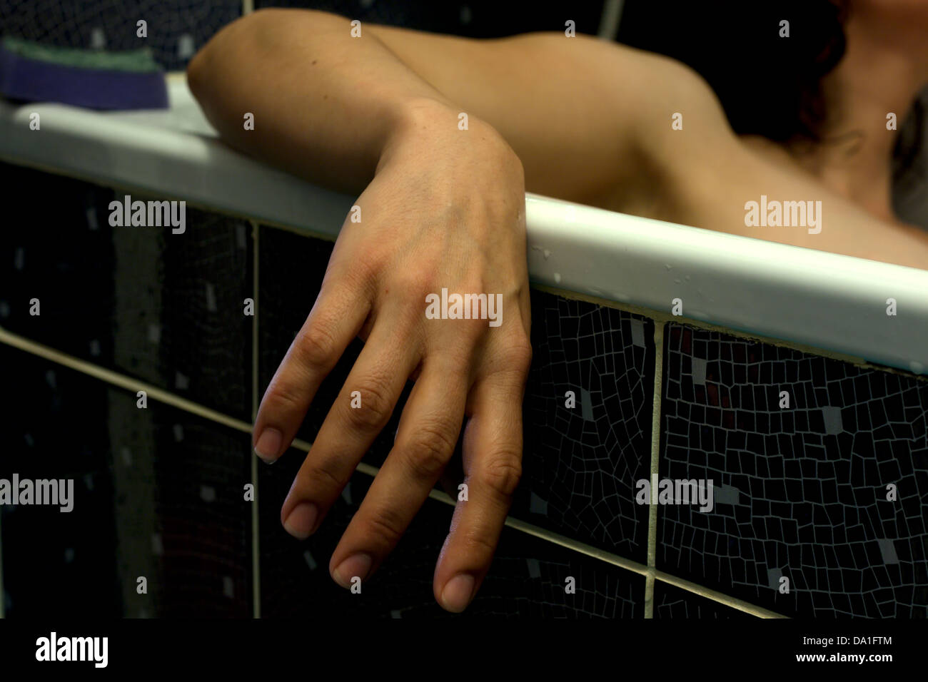 Dead body of woman in the bathroom in bath Stock Photo