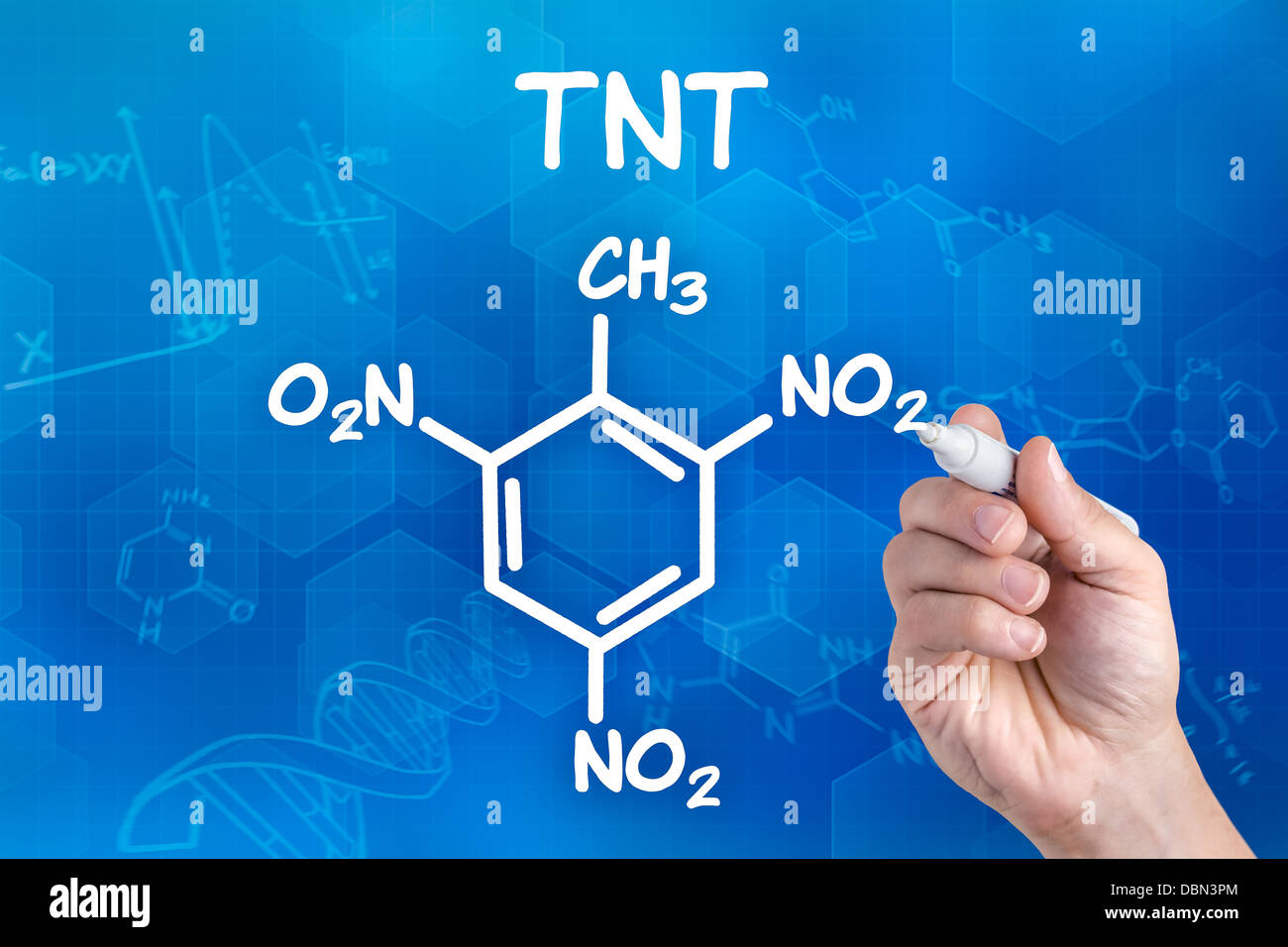 hand with pen drawing the chemical formula of TNT Stock Photo