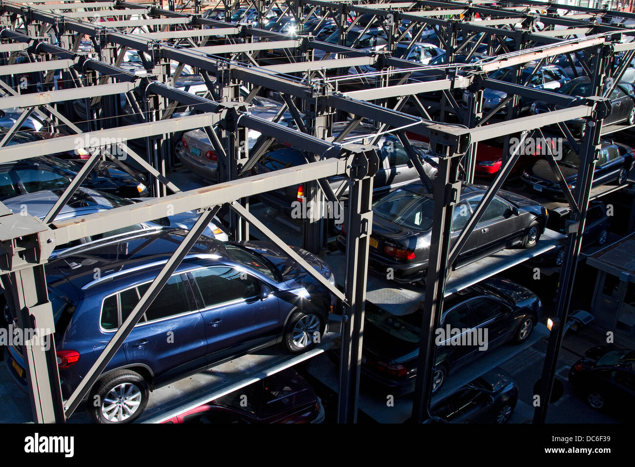 New York carpark, elevated parking garage with stacked cars. Stock Photo