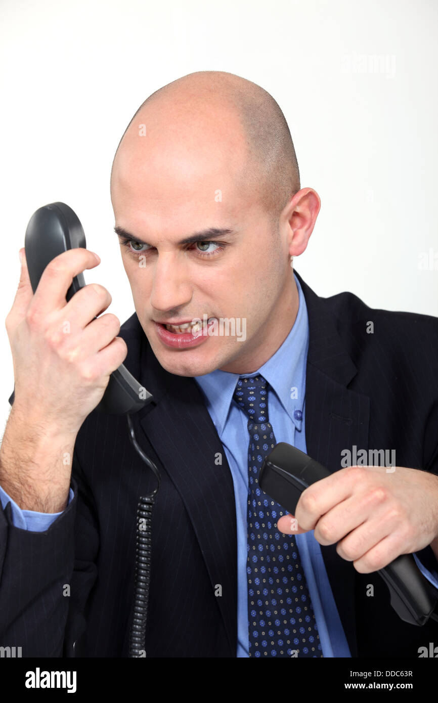 Furious man on the phone Stock Photo