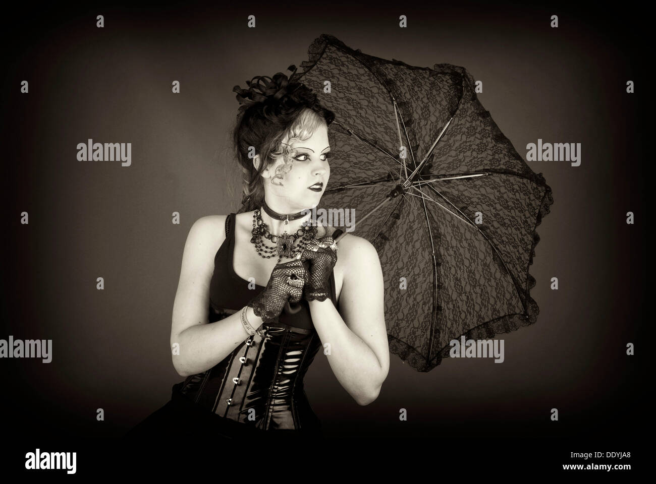 Woman, Gothic, parasol, corset Stock Photo