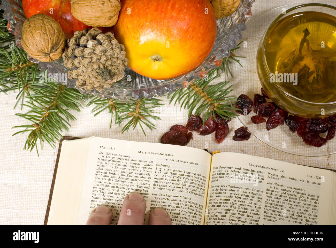 Christmas still life with bible and fruits Stock Photo