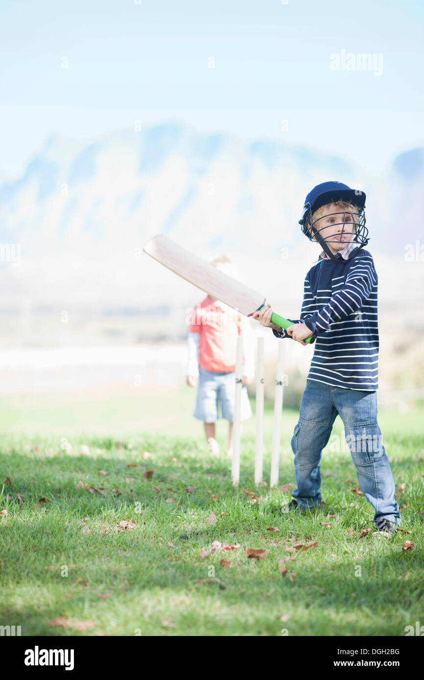 Boys playing cricket Stock Photo