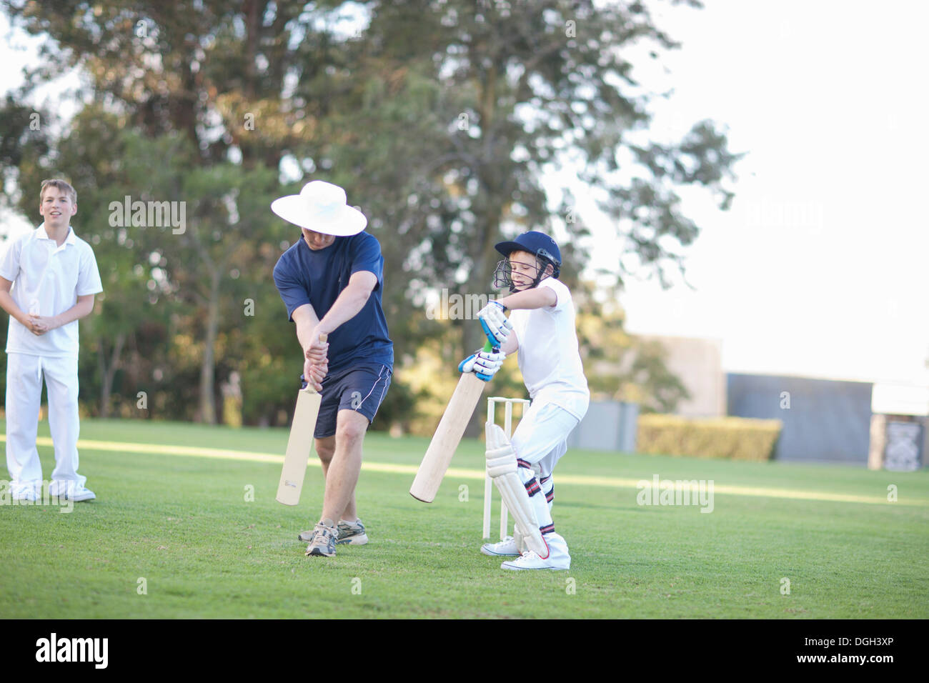 Boys playing cricket Stock Photo