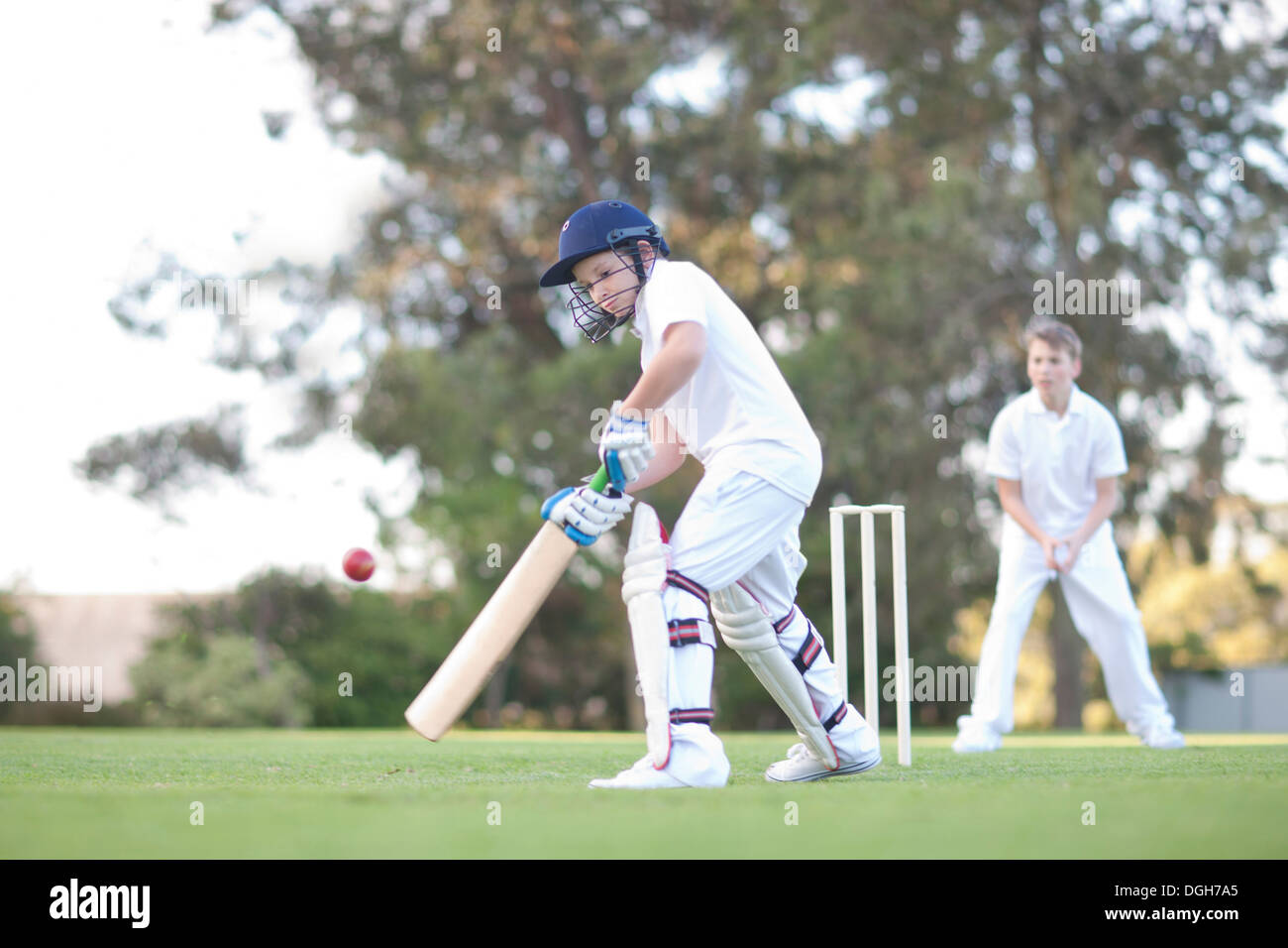 Boys playing cricket Stock Photo