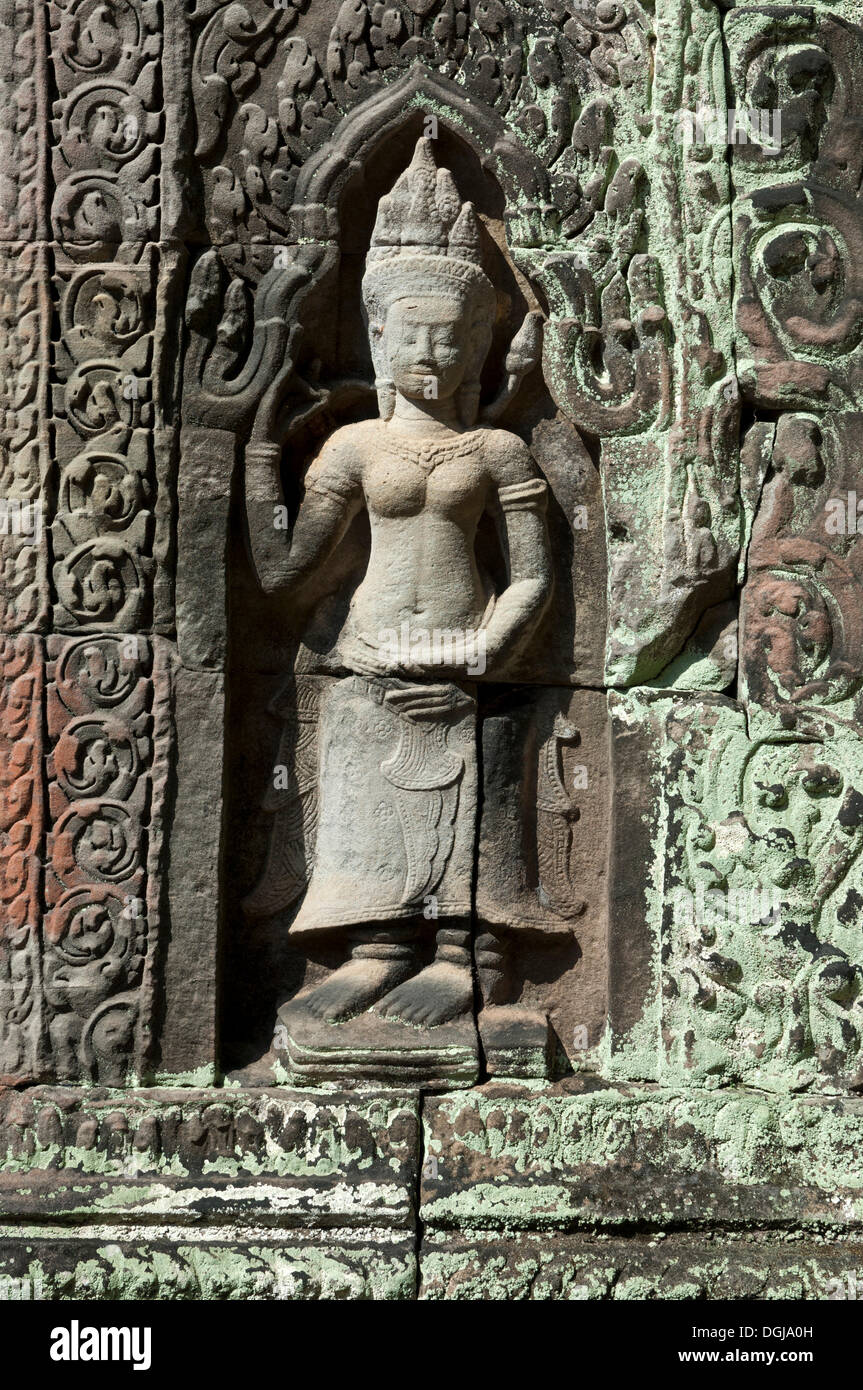 Bas-relief of a female deity, Devata, as temple guard, Preah Khan Temple, built by King Jayavarman VII in the 12th century Stock Photo