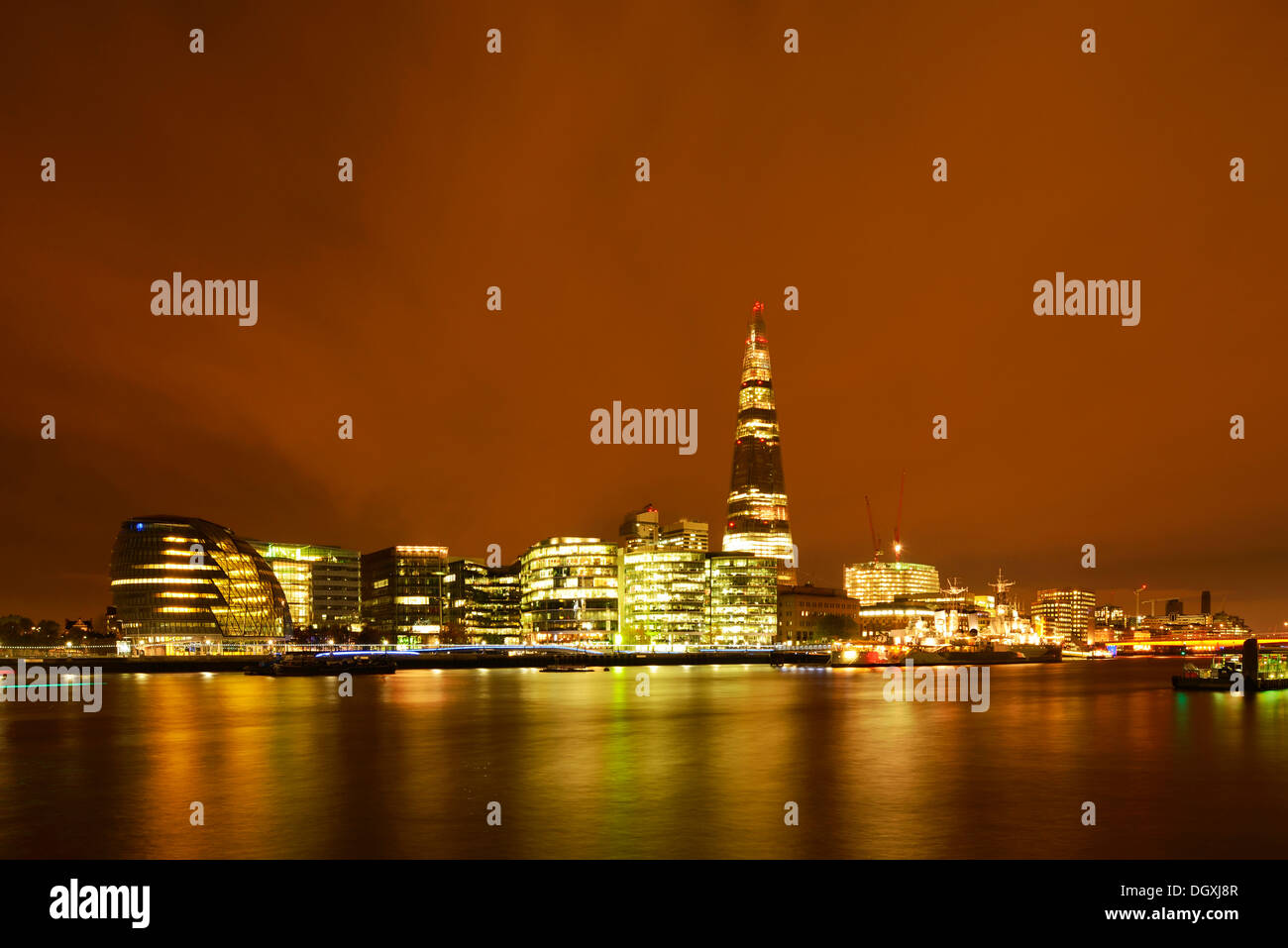 City Hall, designed by Norman Foster, and The Shard or London Bridge Tower designed by Renzo Piano, at night, London, England Stock Photo