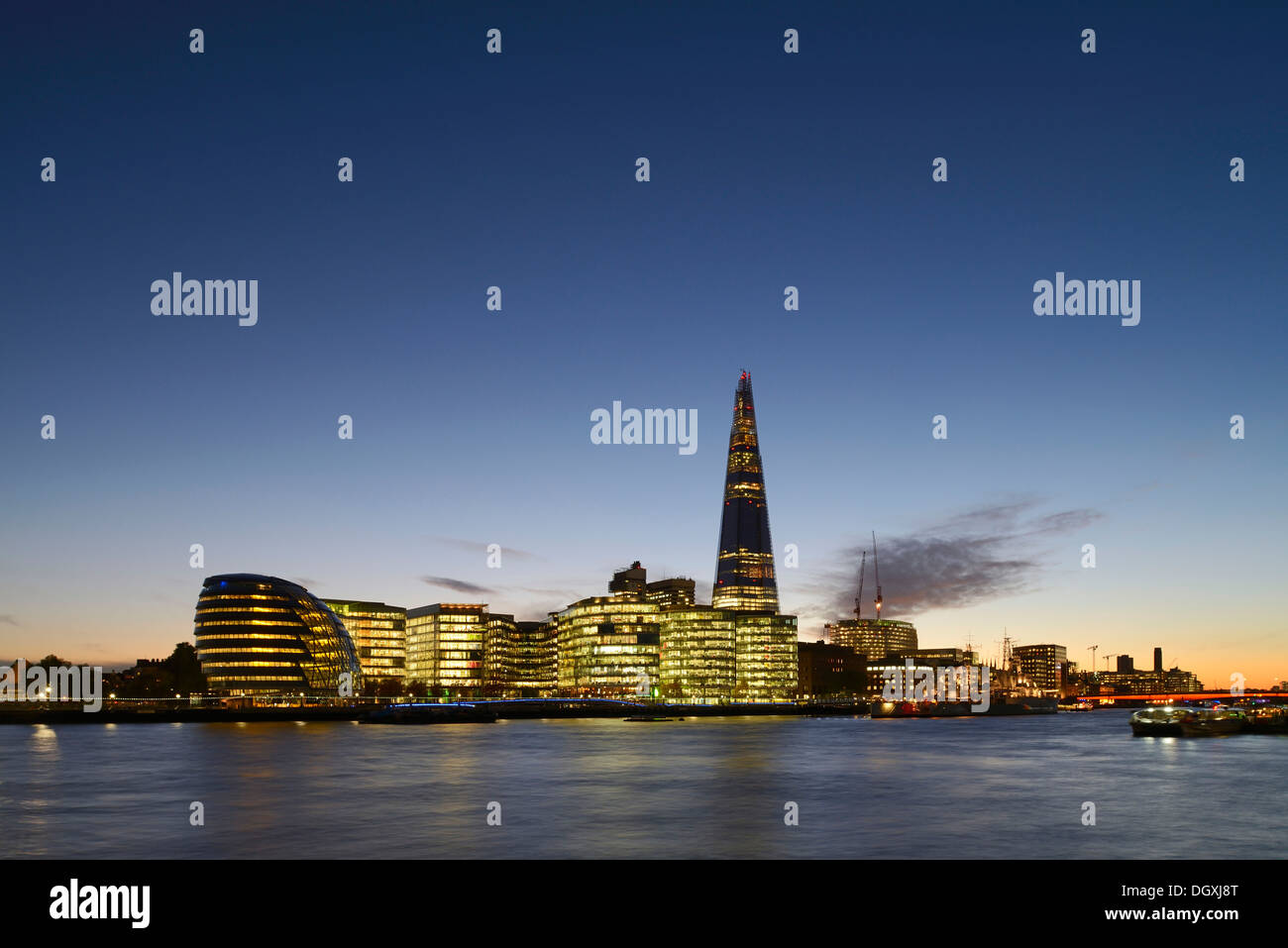 City Hall, designed by Norman Foster, and The Shard or London Bridge Tower designed by Renzo Piano, at dusk, London, England Stock Photo