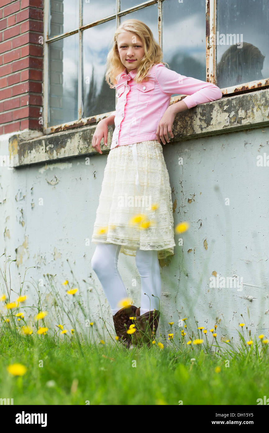 Caucasian girl smiling outdoors Stock Photo