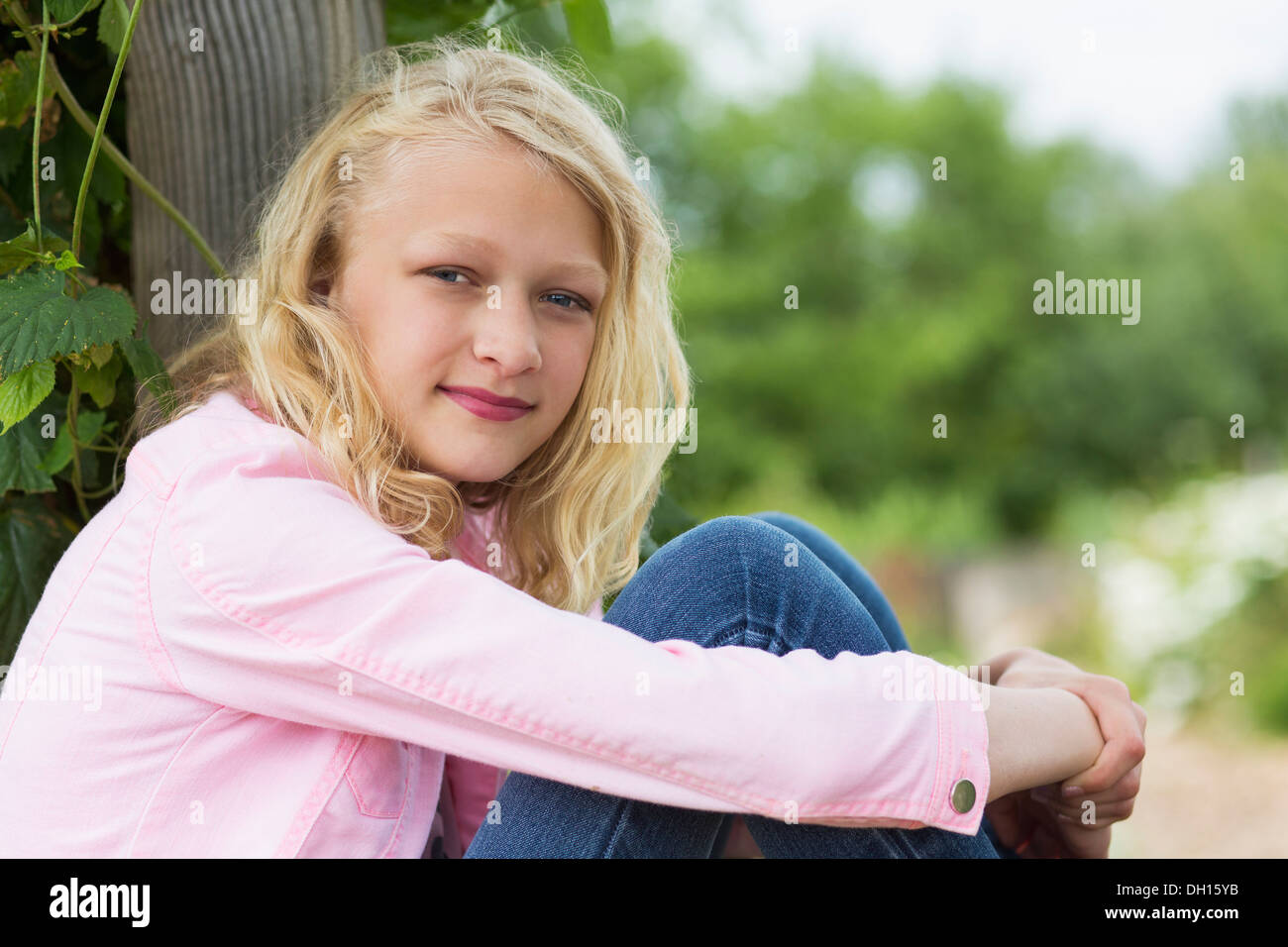 Caucasian girl smiling outdoors Stock Photo