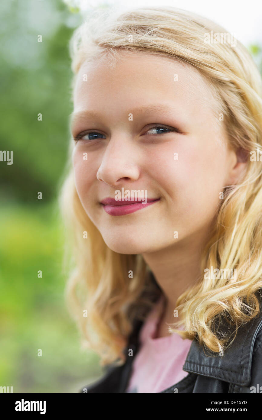 Caucasian girl smiling outdoors Stock Photo