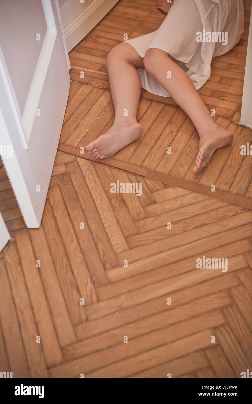 dead woman lying on the floor Stock Photo