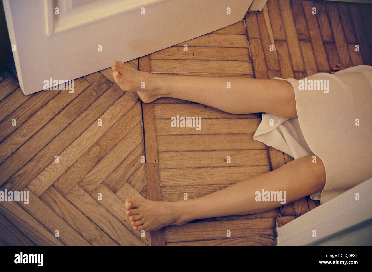 dead woman lying on the floor Stock Photo