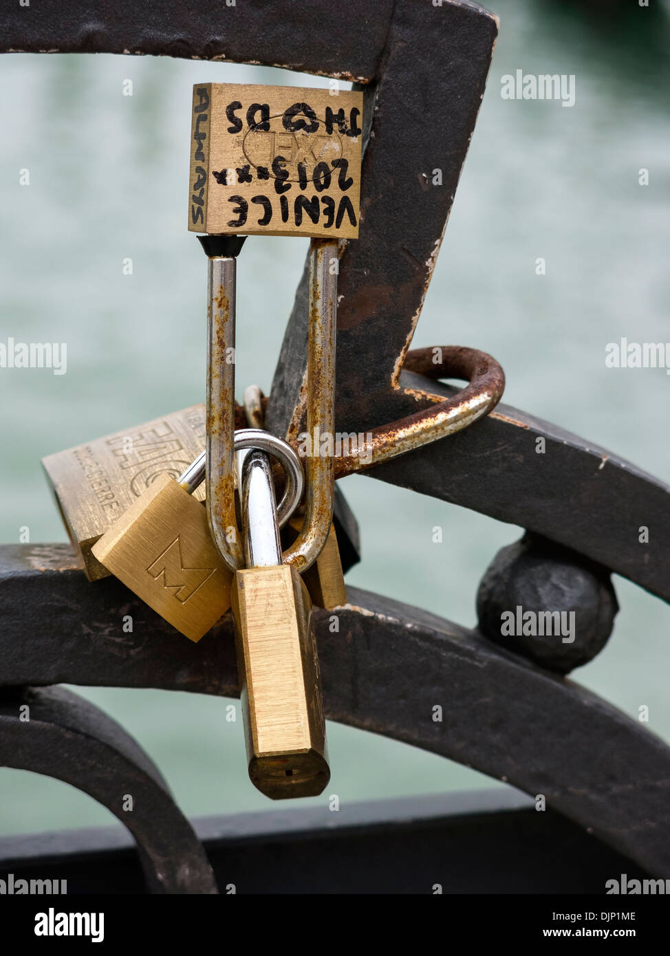 Golden Love Lock padlocks fixed to metal railings Venice, Italy Stock Photo