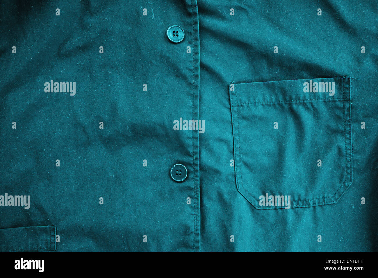 Blue coveralls detail. Working clothes detail. Stock Photo