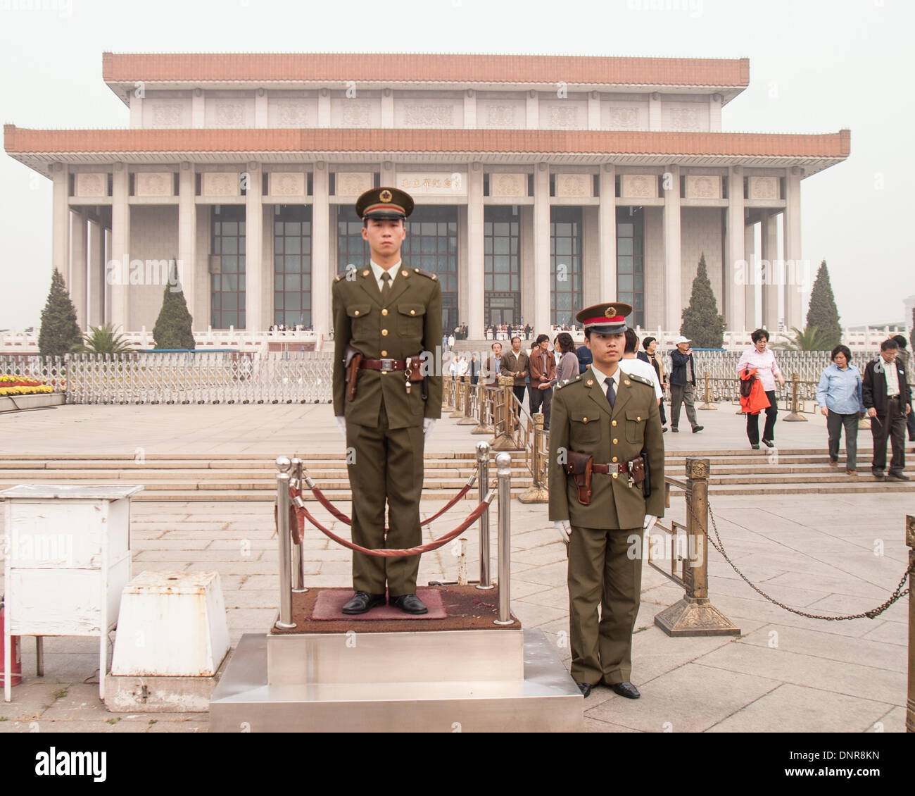 Beijing, China. 16th Oct, 2006. A pair of soldiers of the Chinese People's Liberation Army (PLA) stand guard by a heroic sculpture depicting workers, peasants and soldiers near the entrance to the Chairman Mao Memorial Hall, commonly known as the Mausoleum of Mao Zedong, his the final resting place. This highly popular attraction is located in Tiananmen Square in Beijing, the capital of the Peoples Republic of China © Arnold Drapkin/ZUMAPRESS.com/Alamy Live News Stock Photo