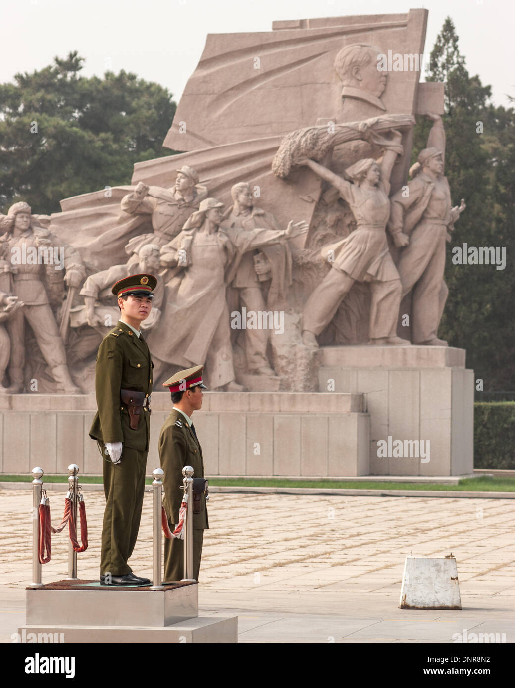 Beijing, China. 16th Oct, 2006. A pair of soldiers of the Chinese People's Liberation Army (PLA) stand guard by a heroic sculpture depicting workers, peasants and soldiers near the entrance to the Chairman Mao Memorial Hall, commonly known as the Mausoleum of Mao Zedong, his the final resting place. This highly popular attraction is located in Tiananmen Square in Beijing, the capital of the Peoples Republic of China © Arnold Drapkin/ZUMAPRESS.com/Alamy Live News Stock Photo