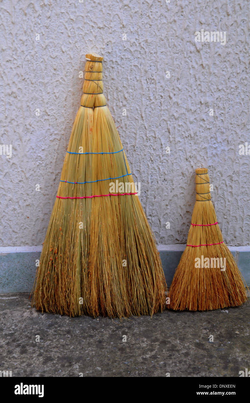 Brooms by the wall. Stock Photo