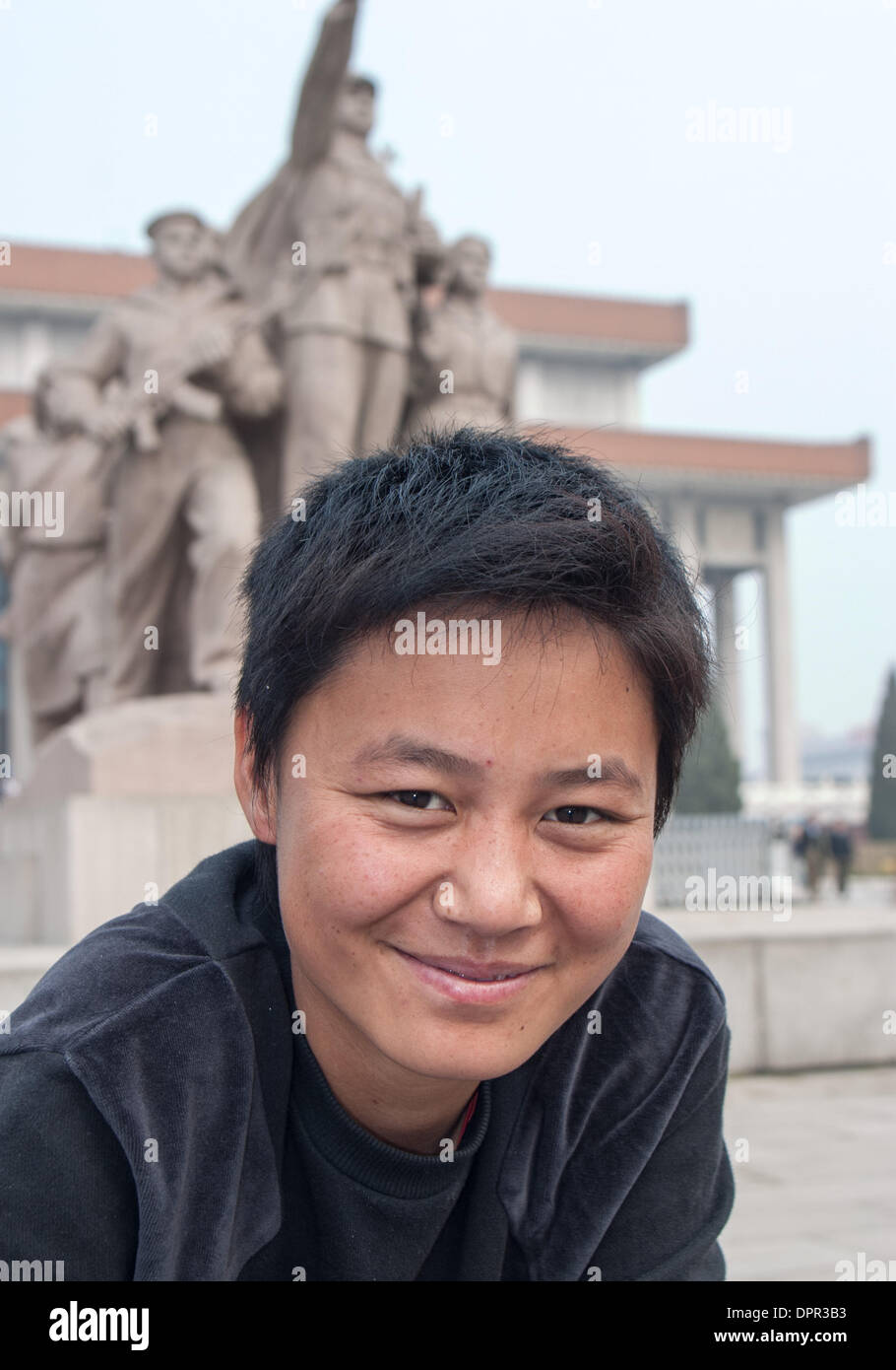 Beijing, China. 16th Oct, 2006. Portrait of a Chinese boy posed before the heroic sculpture depicting workers, peasants and soldiers near the entrance to the Chairman Mao Memorial Hall, commonly known as the Mausoleum of Mao Zedong, his final resting place. This highly popular attraction is located in Tiananmen Square in Beijing, the capital of the Peoples Republic of China. © Arnold Drapkin/ZUMAPRESS.com/Alamy Live News Stock Photo