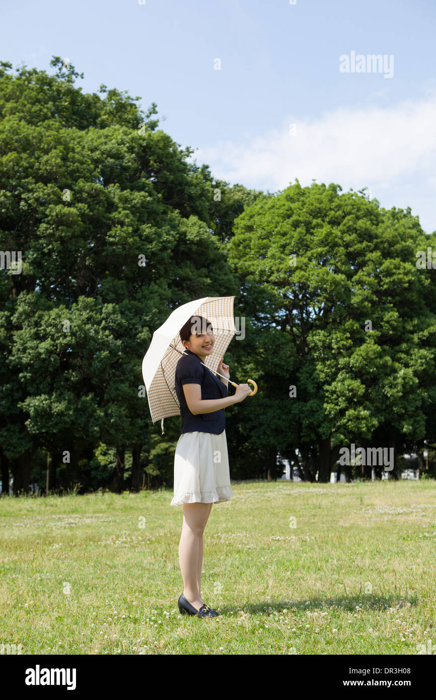 Young woman with parasol Stock Photo