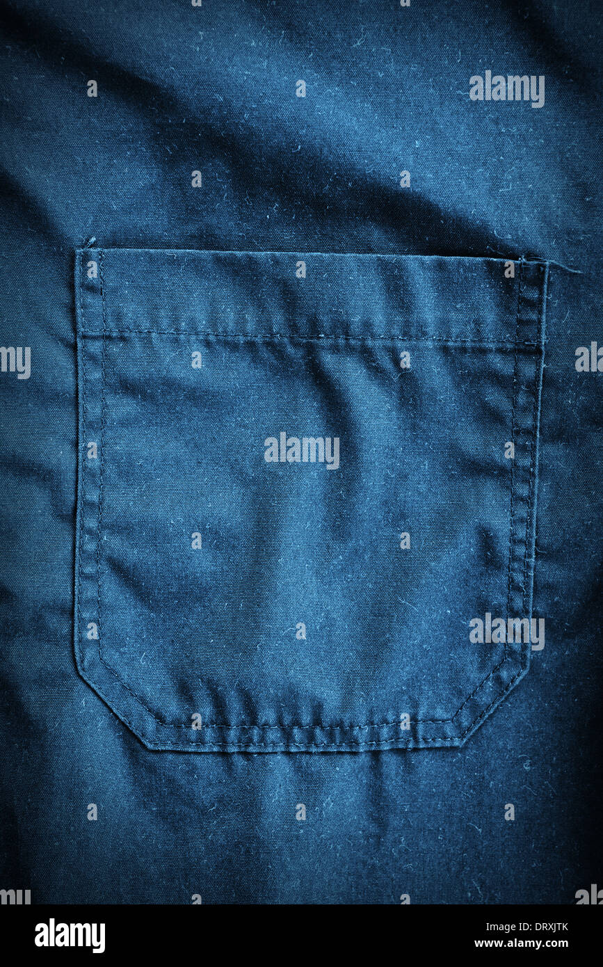 Blue coveralls detail. Working clothes detail. Stock Photo