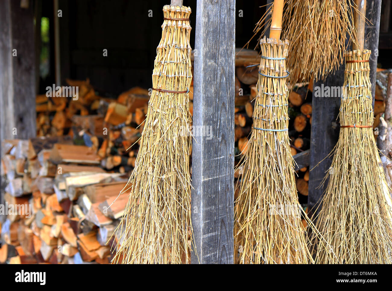 Hanging brooms Stock Photo