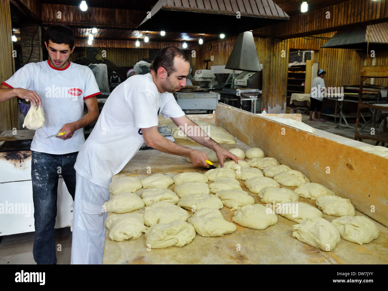 Men bake bread in market's bakery, Spitak, Armenia Stock Photo