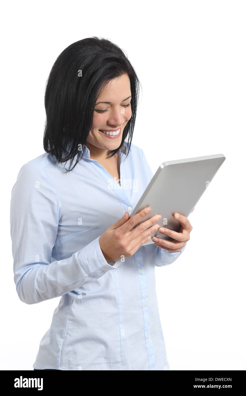 Happy woman reading a tablet reader isolated on a white background Stock Photo