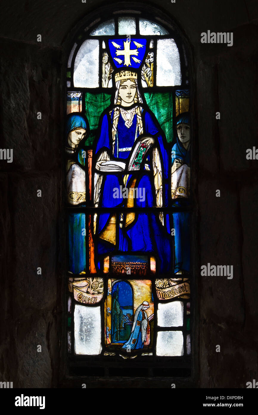 Stained glass window depicting Queen Margaret of Scotland in the Chapel of Saint Margaret in Edinburgh Castle. Stock Photo