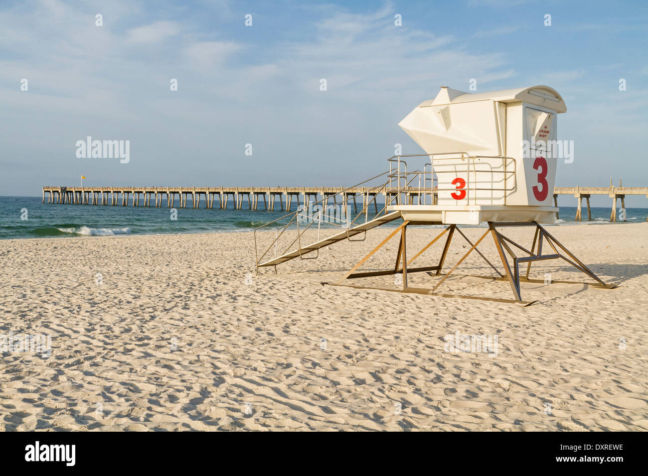 A lifeguard station and the fishing pier in the early morning on Pensacola Beach, Florida. Stock Photo