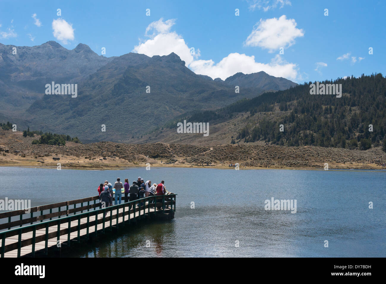 Tourists watching mountain and lake, Sierra Nevada National Park, Venezuela Stock Photo