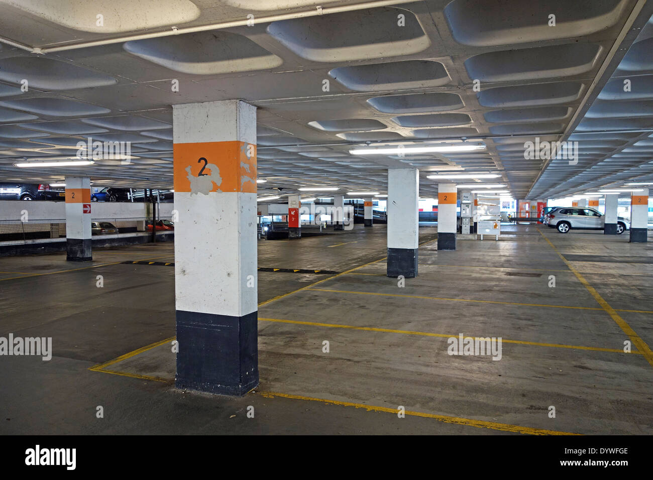 an almost empty indoor carpark Stock Photo