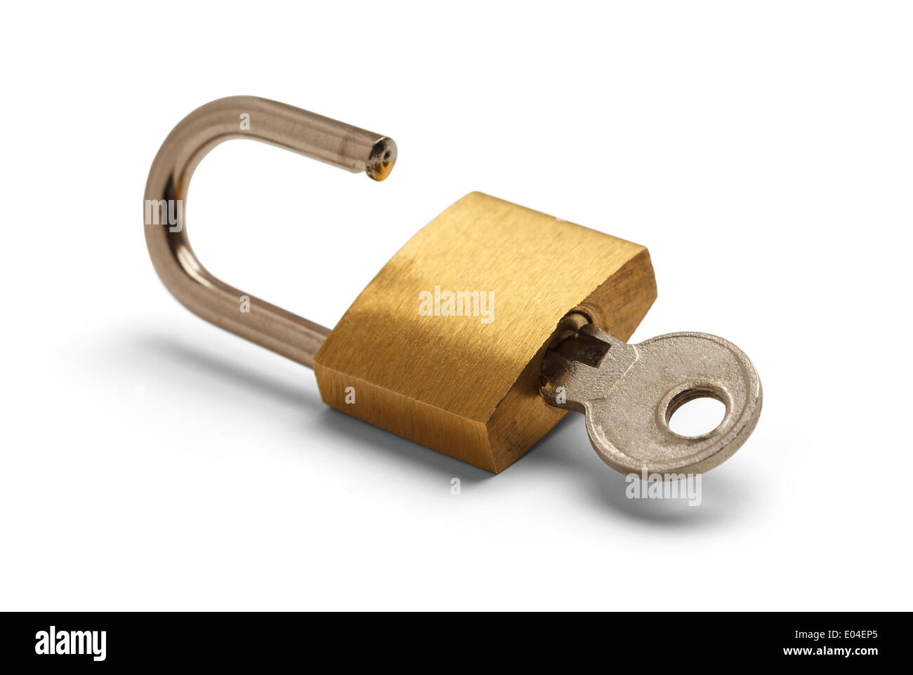 Brass Padlock Unlocked with Key Isolated on White Background. Stock Photo