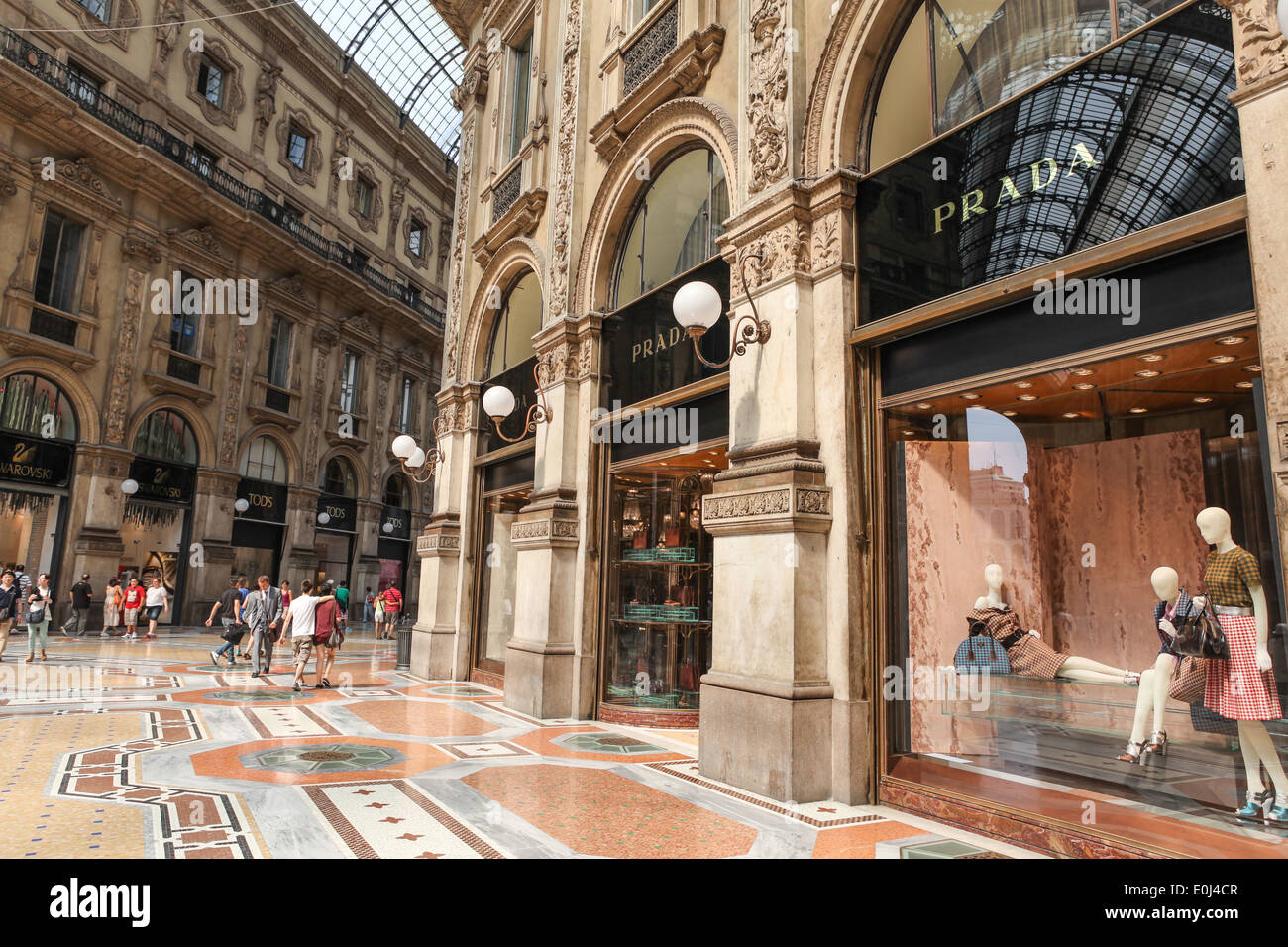 Prada Store in Galleria Vittorio Emanuele II shopping center in Milan, Italy with shoppers and tourists strolling around. Stock Photo