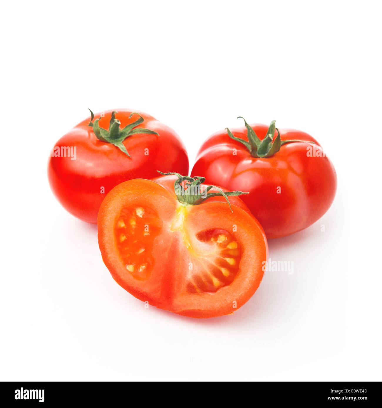 Fresh red Tomato and half slice on white background, tasty organic vegetable for healthy eating. Stock Photo