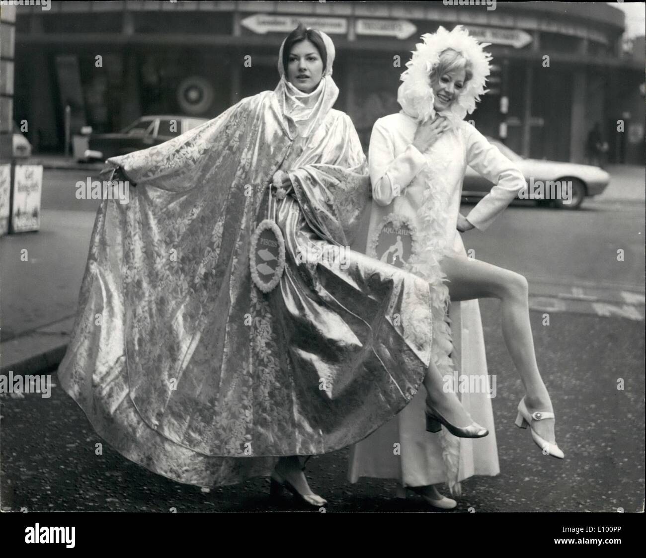 Feb. 02, 1972 - Horoscope collection of wedding dresses by youngs dress hire.: Star model Vicki Hodge and Jackie Craven were outside the Planetarium, Baker Street today, to launch, appropriately enough the Horoscope collection of wedding dresses for starry-eyed brides of 1972 by Youngs Dress Hire. Wearing galaxy make-up motifs and carrying symbols of the the Zodiac , Vicki and Jackie showed off six of the twelve styles in the range - Aquarius Pieces, Aries Taurus, Gemini and Dancer Stock Photo