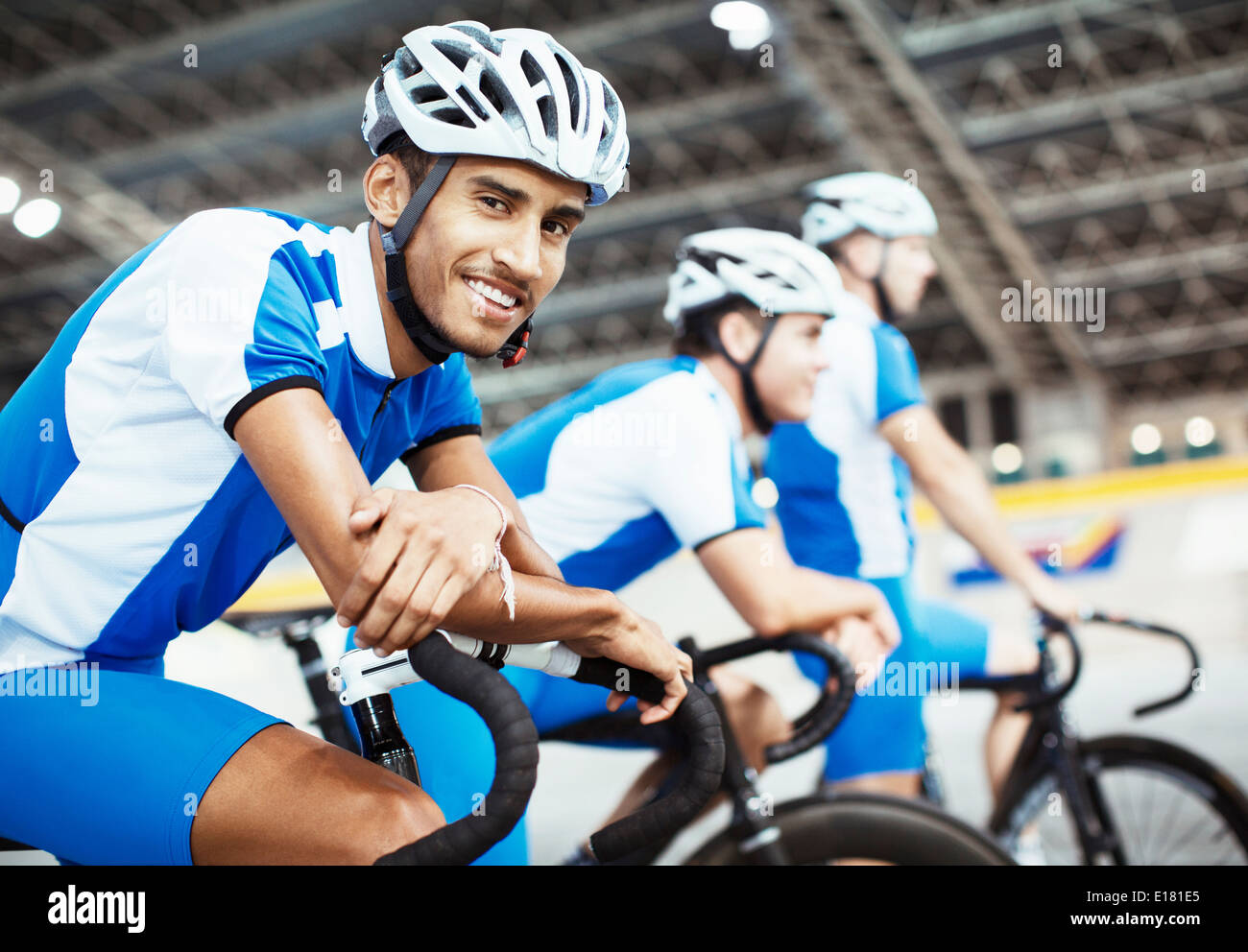 Track cycling team waiting in velodrome Stock Photo