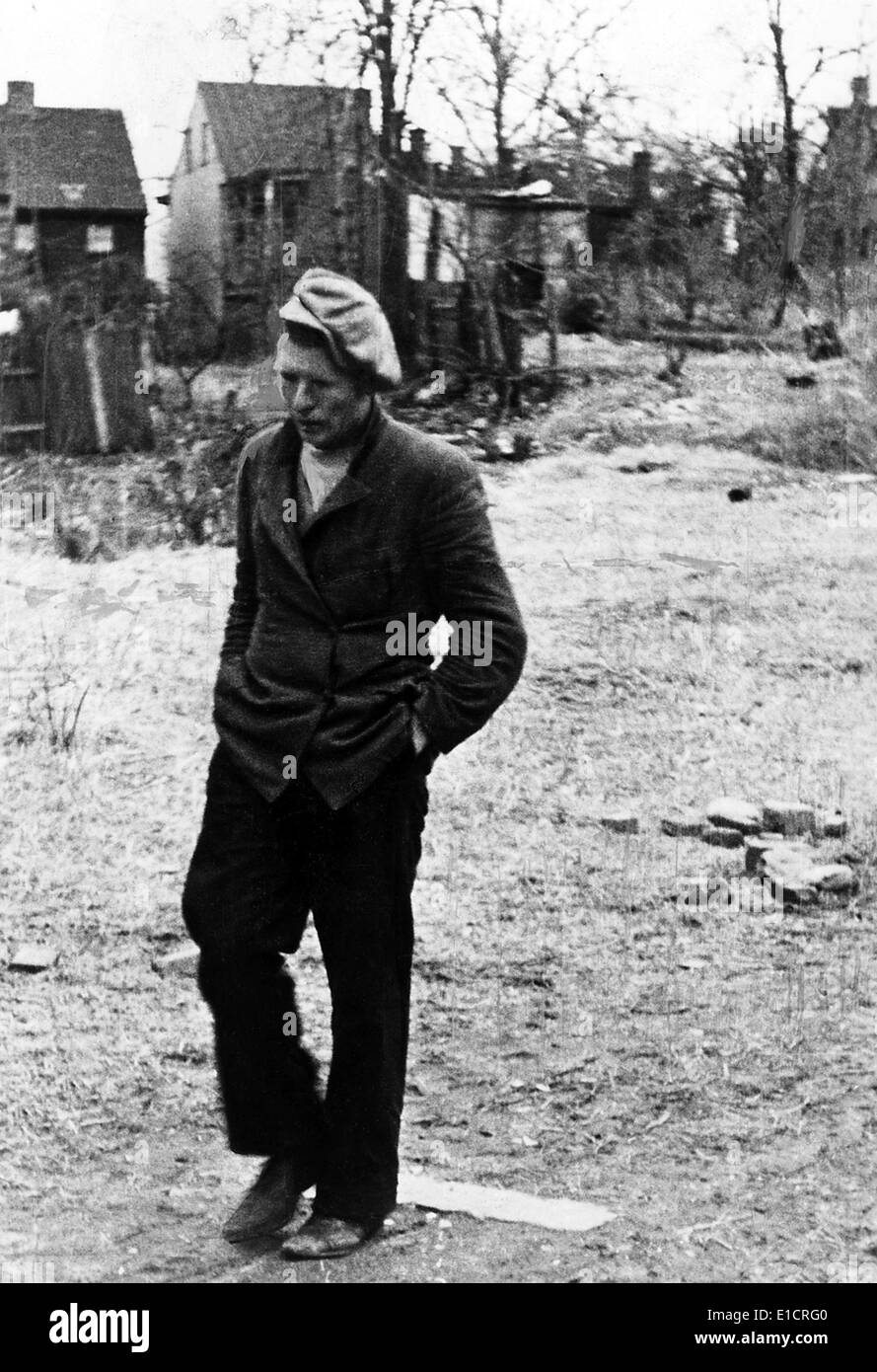 The Great Depression. A poor man walking through a vacant lot. 1930s Stock Photo