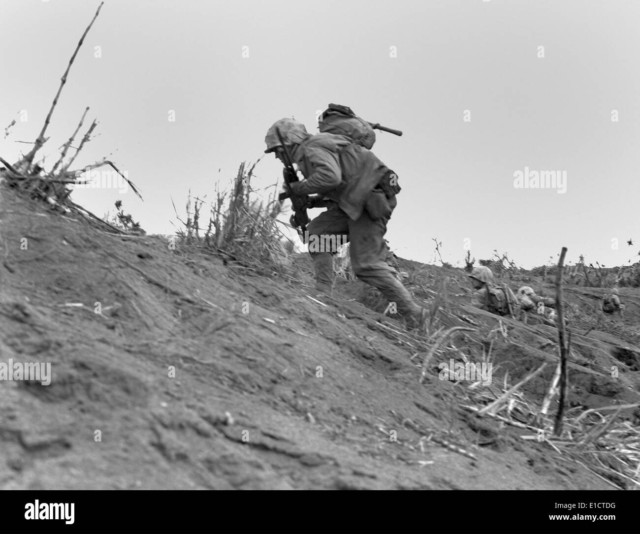 Marines moving near Iwo Jima's airport on Feb. 22, 1945. They are with the 5th Division, 1st Battalion, 26th Marines. Photo Stock Photo