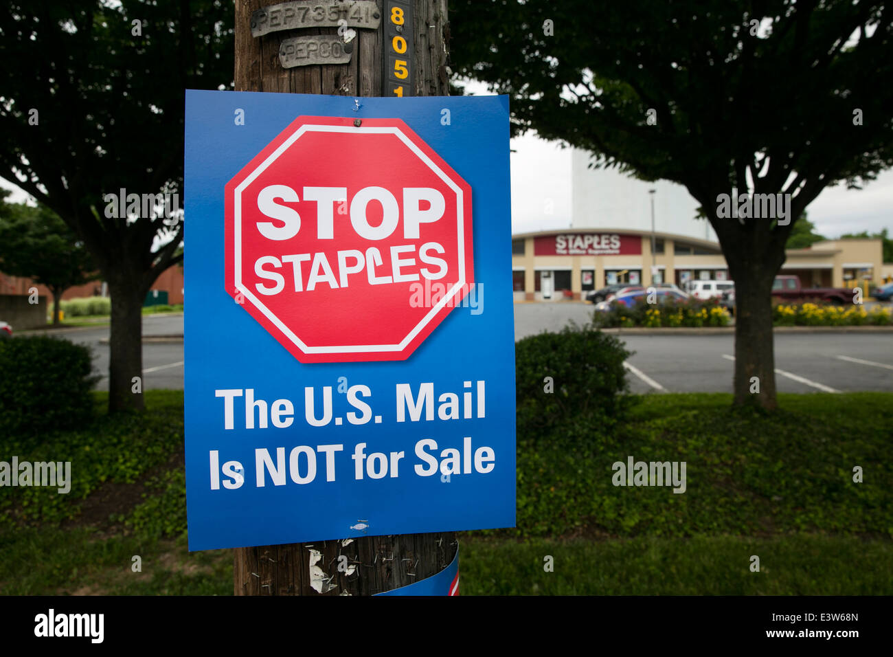 A sign protesting the opening of contract United States Post Office branches inside of Staples retail stores in Silver, Maryland. Stock Photo