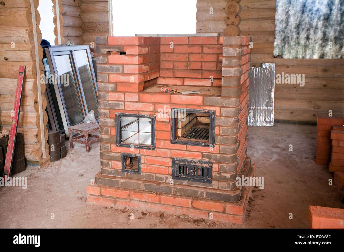 half unfinished big brick stove in countryside house Stock Photo