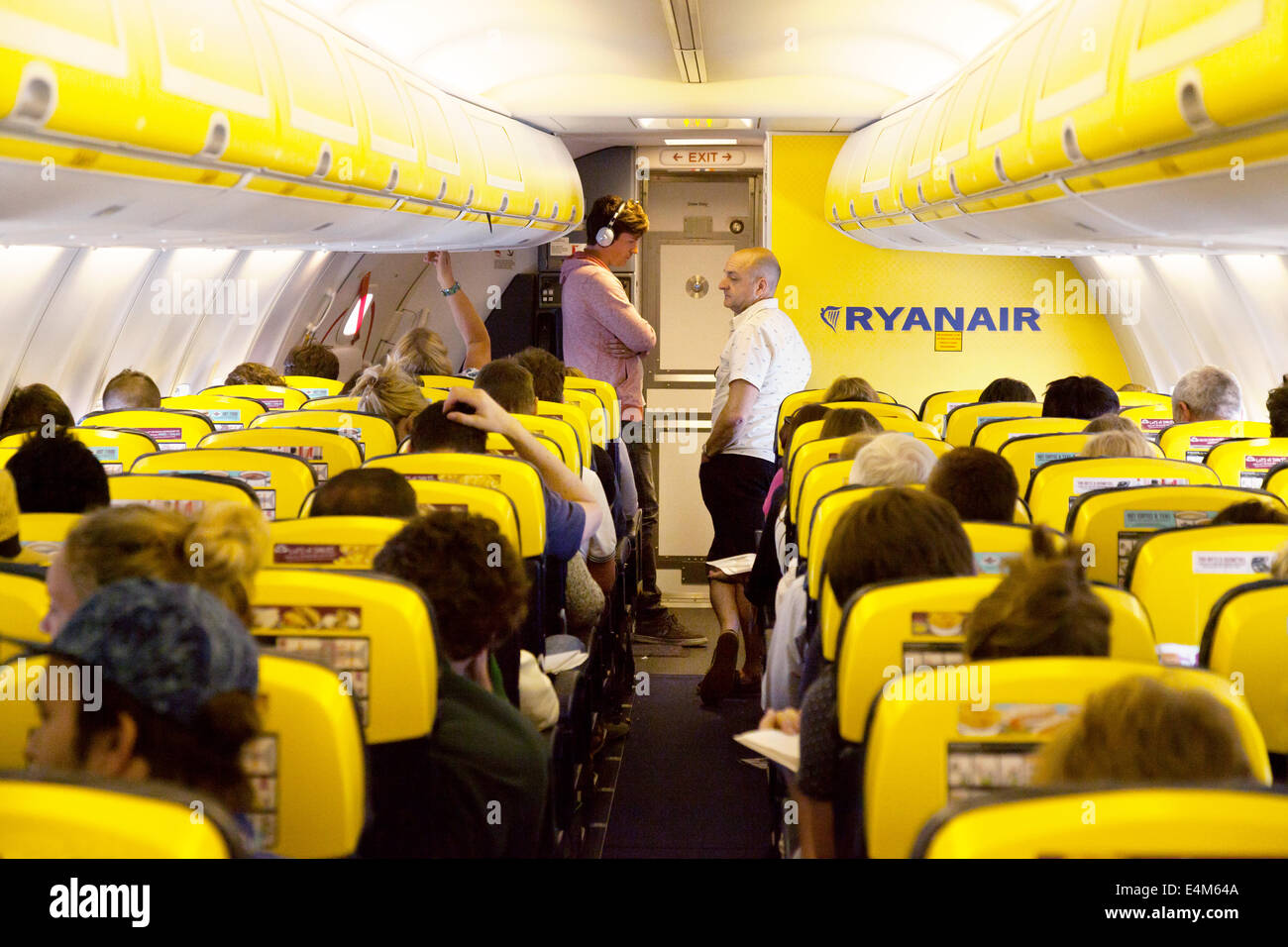 Passengers in a queue for the toilet during a flight, Ryanair plane ...