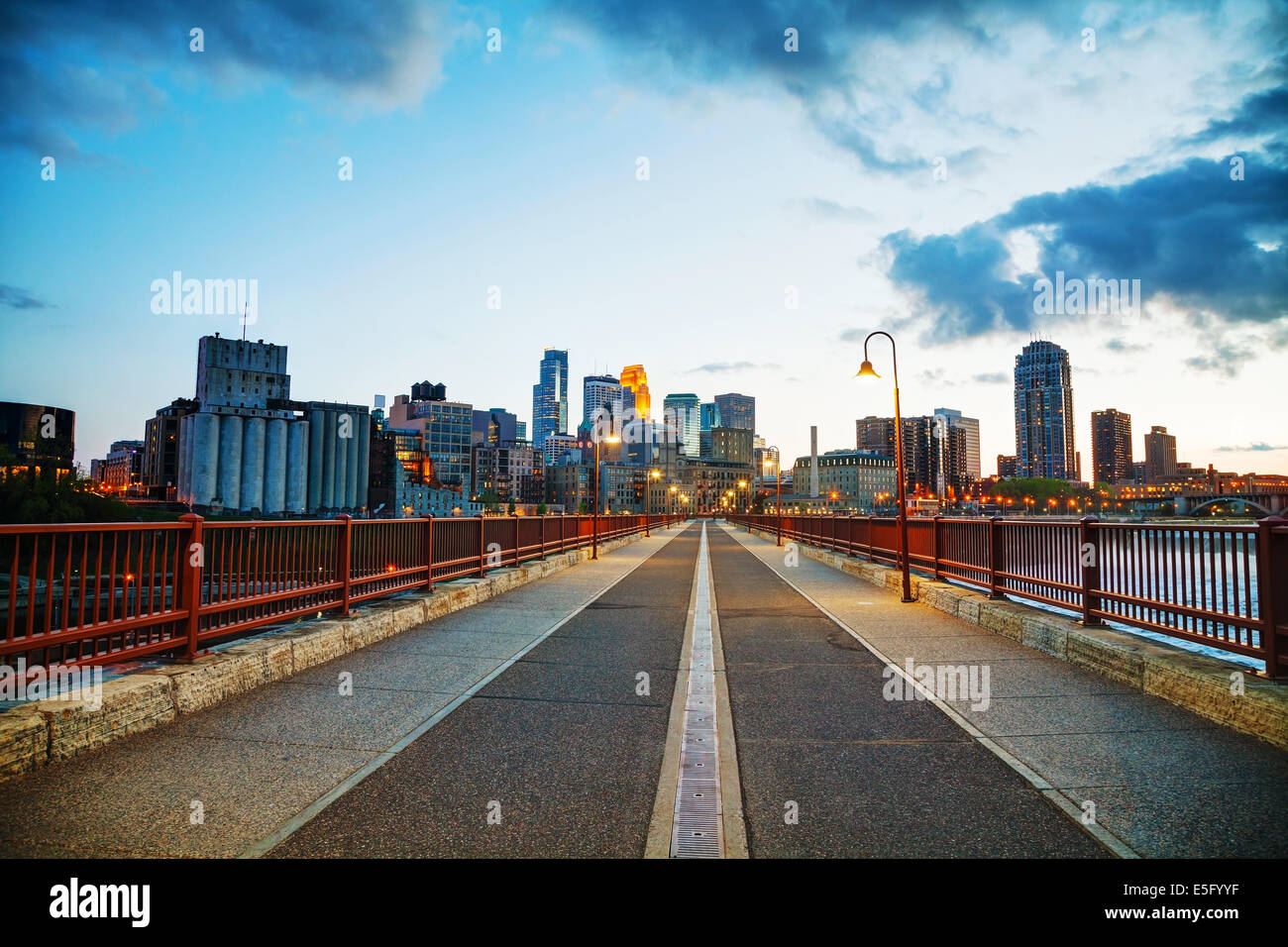 Downtown Minneapolis, Minnesota at night time as seen from the famous stone arch bridge Stock Photo