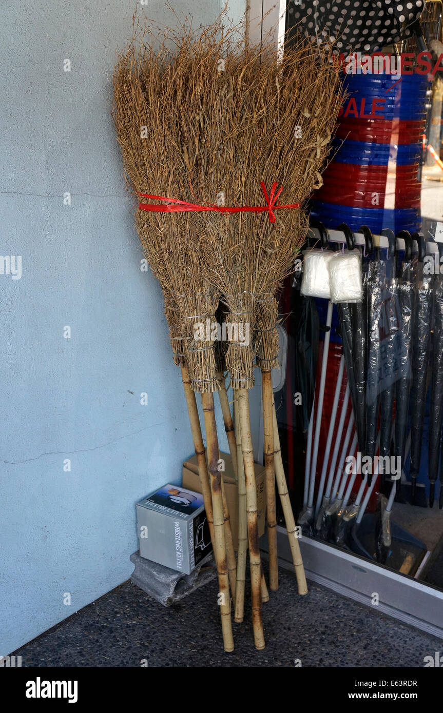 Handmade twig brooms outside a store in Japantown, Vancouver, BC, Canada Stock Photo