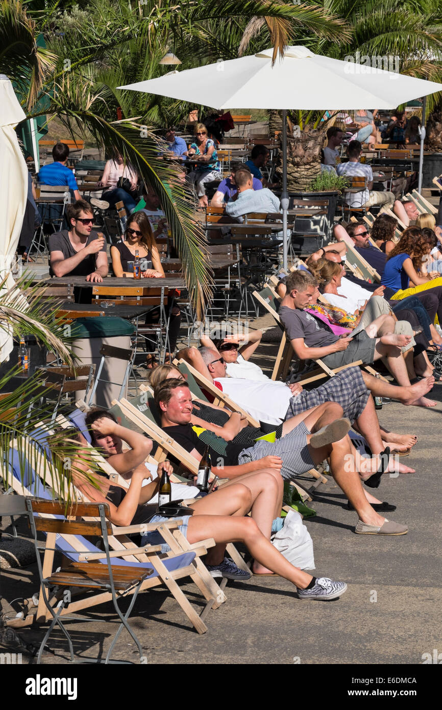 Busy cafe and bar beside Spree River in MonbijouPark Mitte Berlin Stock Photo