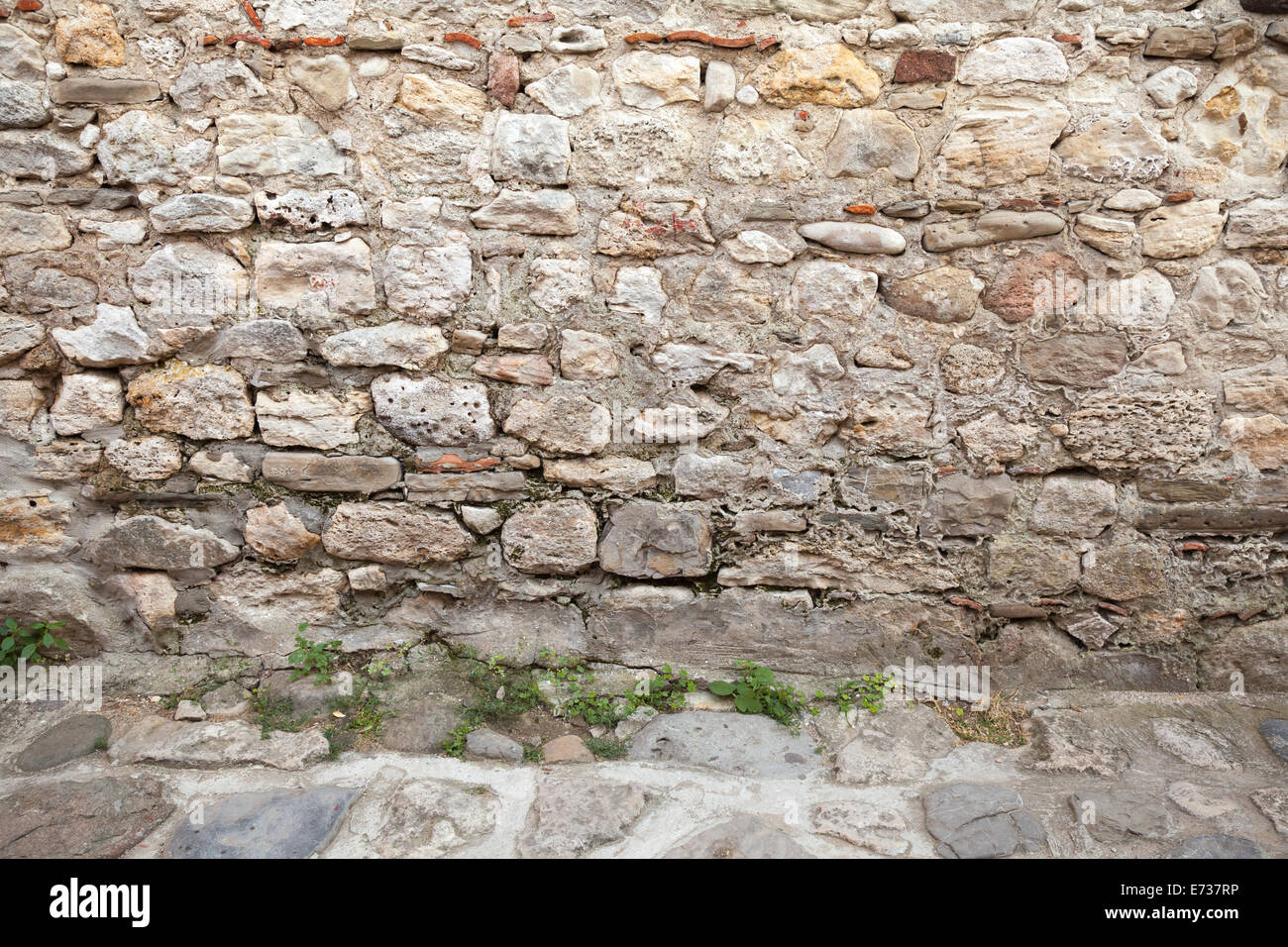 Interior background texture with ancient gray stone wall Stock Photo